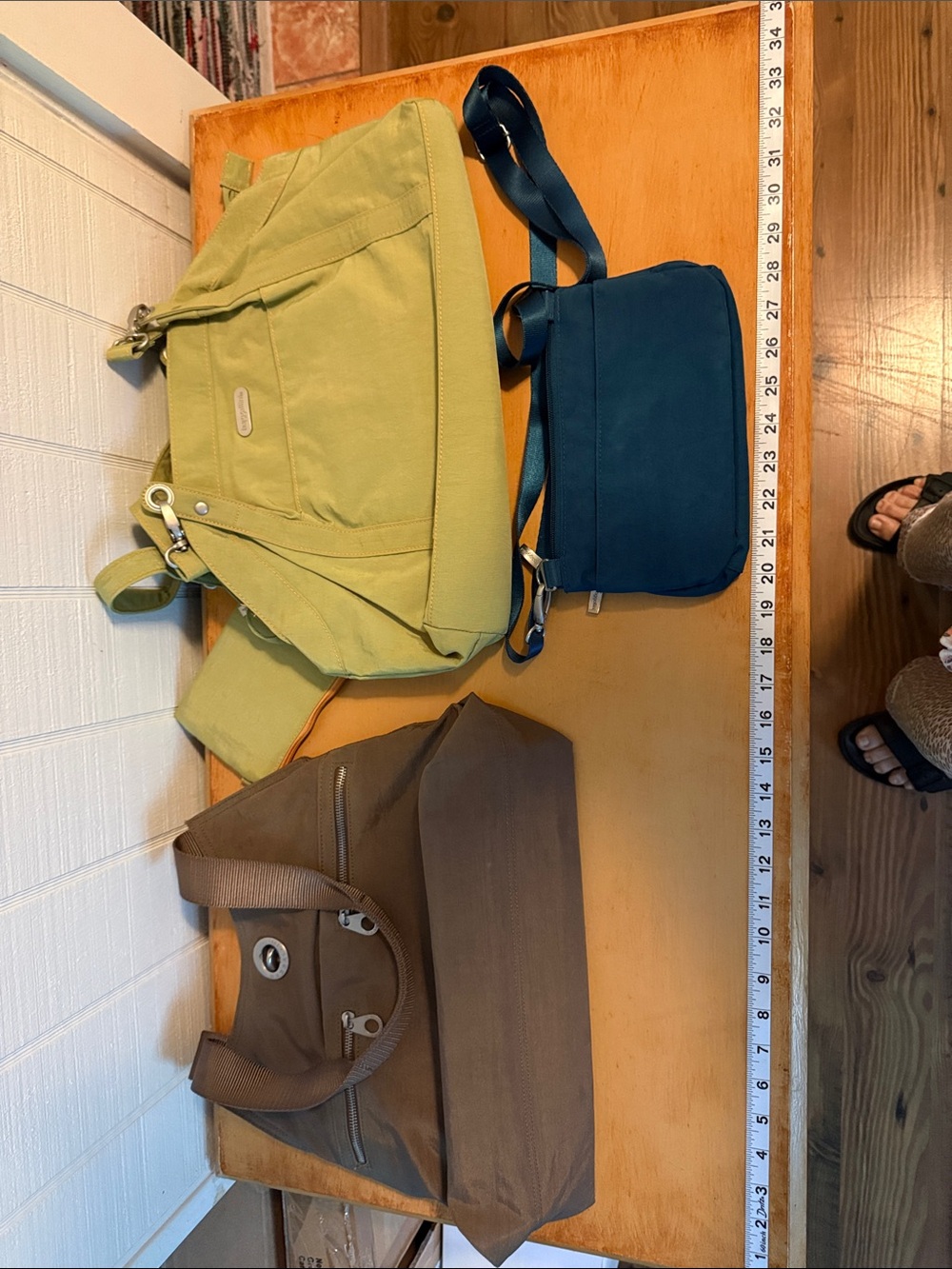 Three gently used baggallini bags.